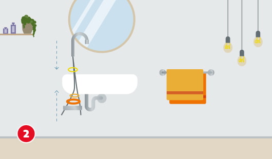 Eine schematische Darstellung zeigt das Einsetzen einer neuen Armatur in ein Waschbecken. Die Armatur wird von oben durch das Hahnloch geführt, während die Dichtungsringe und Befestigungselemente von unten montiert werden. Pfeile markieren den Montageverlauf. Im Hintergrund befinden sich Spiegel, Handtuchhalter, Lampen und ein Regal mit Dekoration. Unten links ist ein roter Kreis mit einer weißen 2
