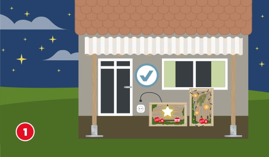 Eine schematische Darstellung zeigt ein Haus mit zwei beleuchteten Dekoboxen vor Fenster und Haustür. Die Boxen sind mit Sternen, Lichterketten und weihnachtlicher Deko geschmückt. Eine Steckdose befindet sich neben der Tür. Ein Häkchensymbol kennzeichnet den geeigneten Standort. Unten links ist ein roter Kreis mit einer weißen 1
